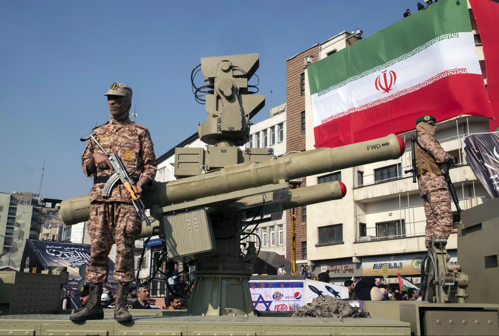 Islamic Revolutionary Guard Corps soldiers stand guard next to an anti-aircraft missile in Tehran. Morteza Nikoubazl / NurPhoto via Getty Images file.