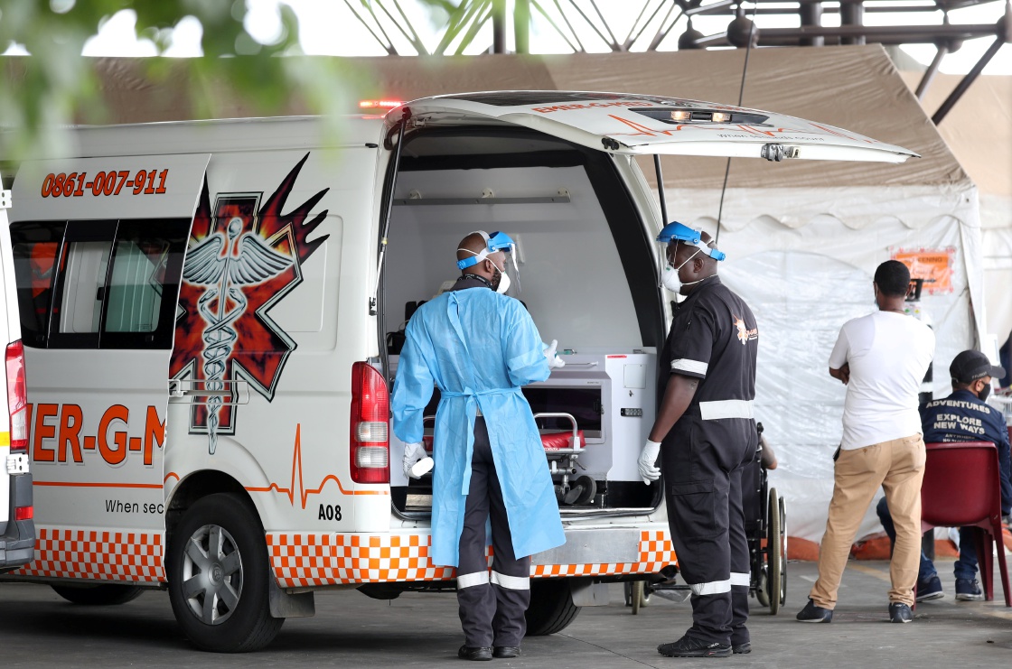 Health workers chat near an ambulance at the parking lot of the Steve Biko Academic Hospital, amid a nationwide coronavirus disease lockdown, in Pretoria on January 11, 2021. Picture: REUTERS/SIPHIWE SIBEKO