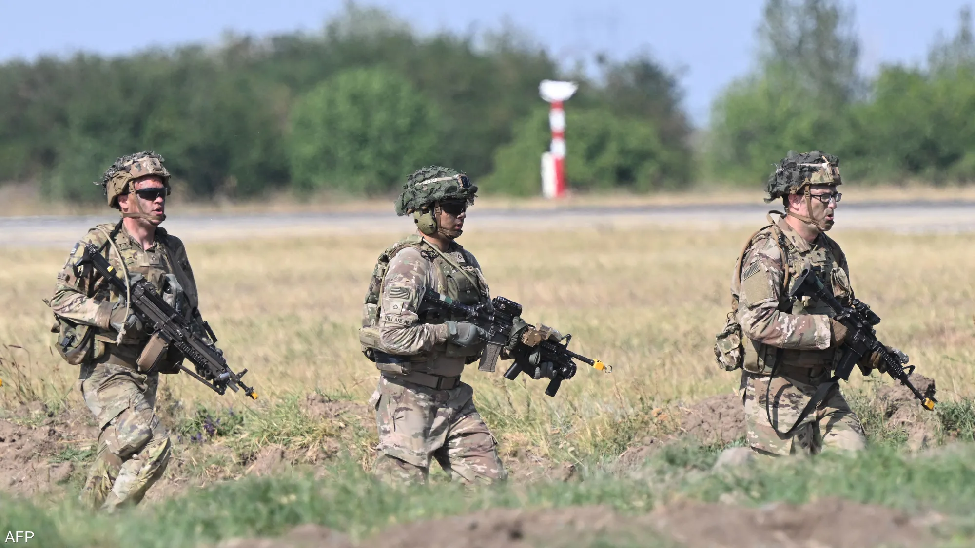 U.S. soldiers patrol a European base, maintaining operational readiness during routine deployment.