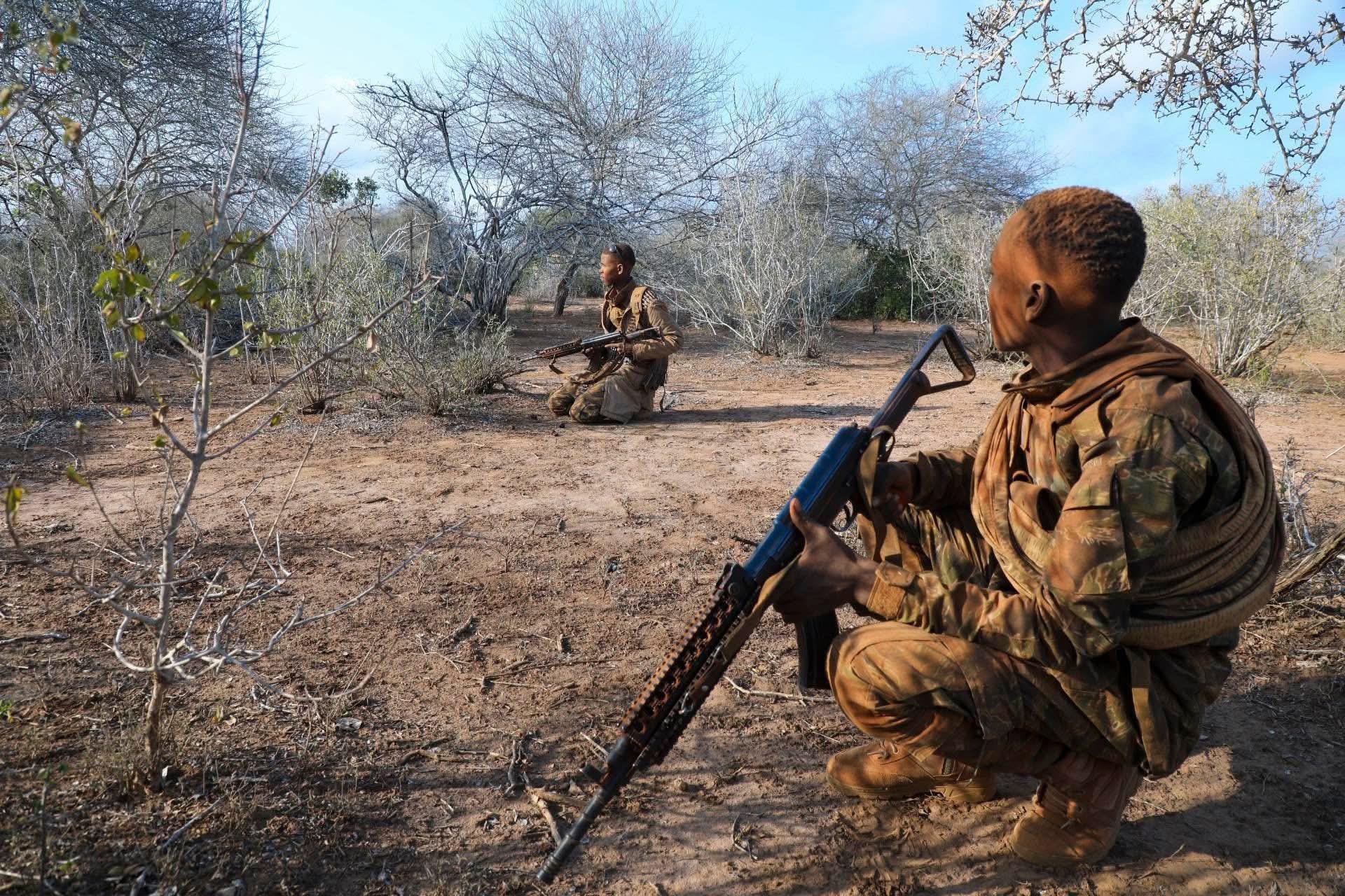 Somalia's elite Danab Commandos patrol a rural area during a security operation, maintaining vigilance as part of ongoing efforts to protect civilians and counter militant activity.