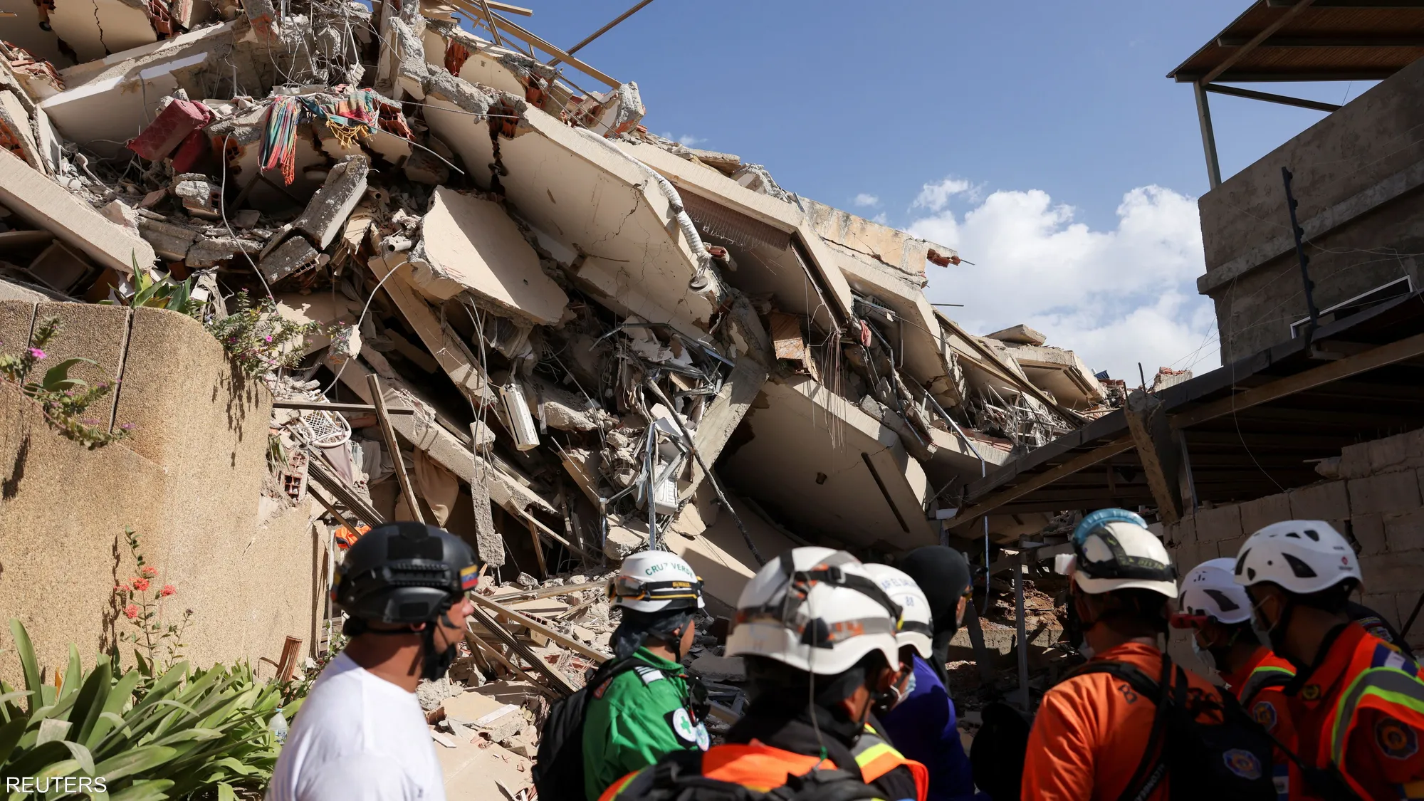 Rescue workers and residents sift through rubble in La Guaira, Venezuela, after powerful earthquakes left widespread destruction and thousands of casualties.