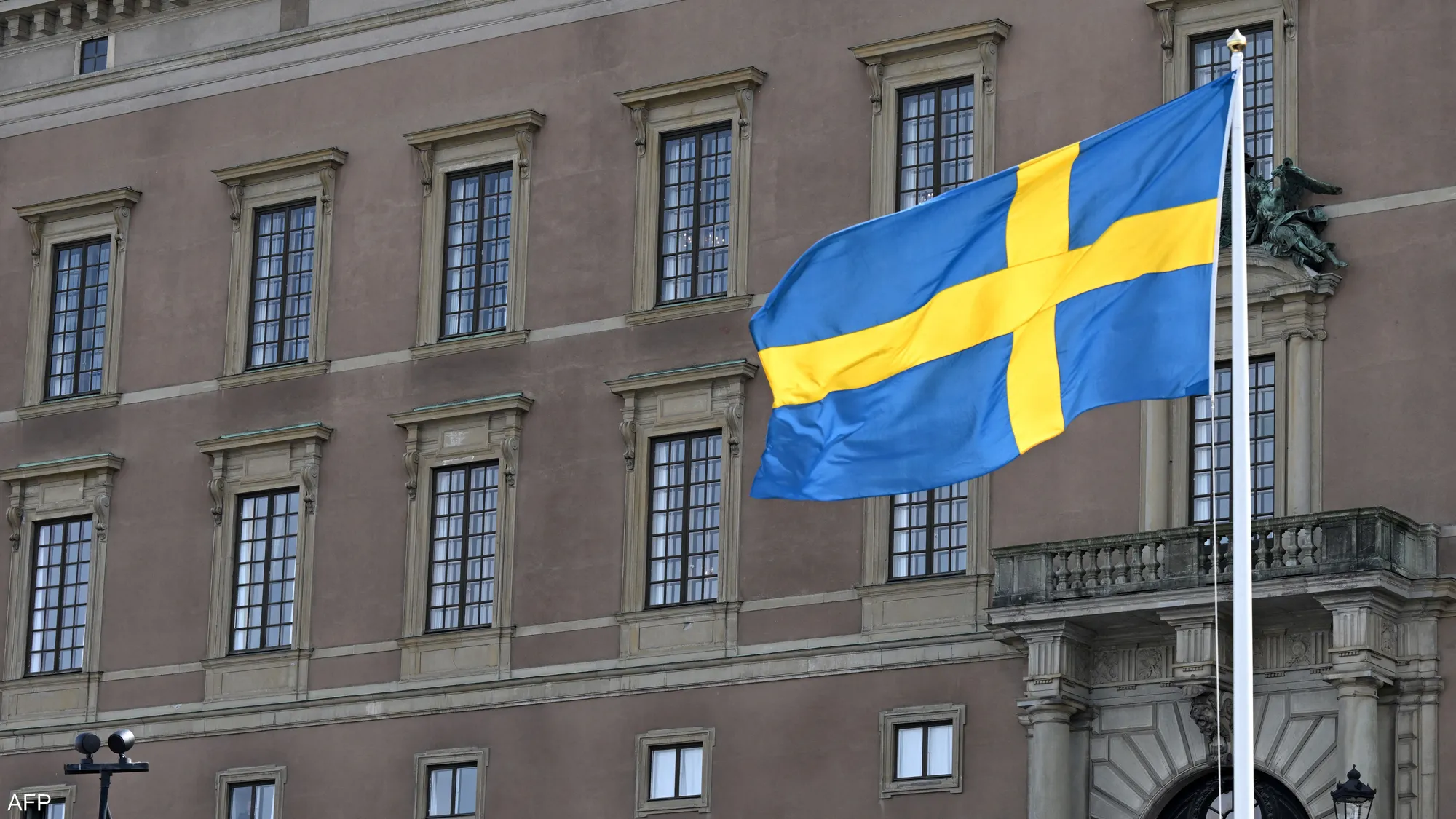 The national flag of Sweden displayed prominently in a calm breeze.