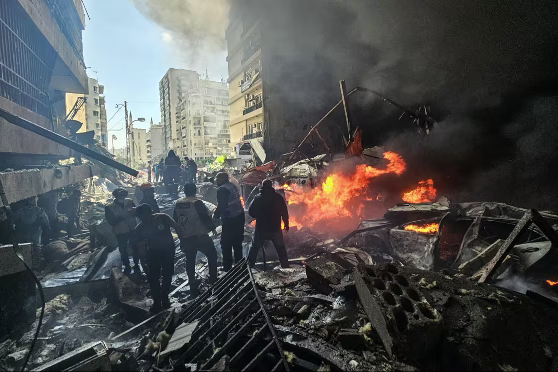 First responders stand amid rubble at the site of an Israeli airstrike in Beirut's Corniche al-Mazraa neighborhood on Wednesday.AFP - Getty Images