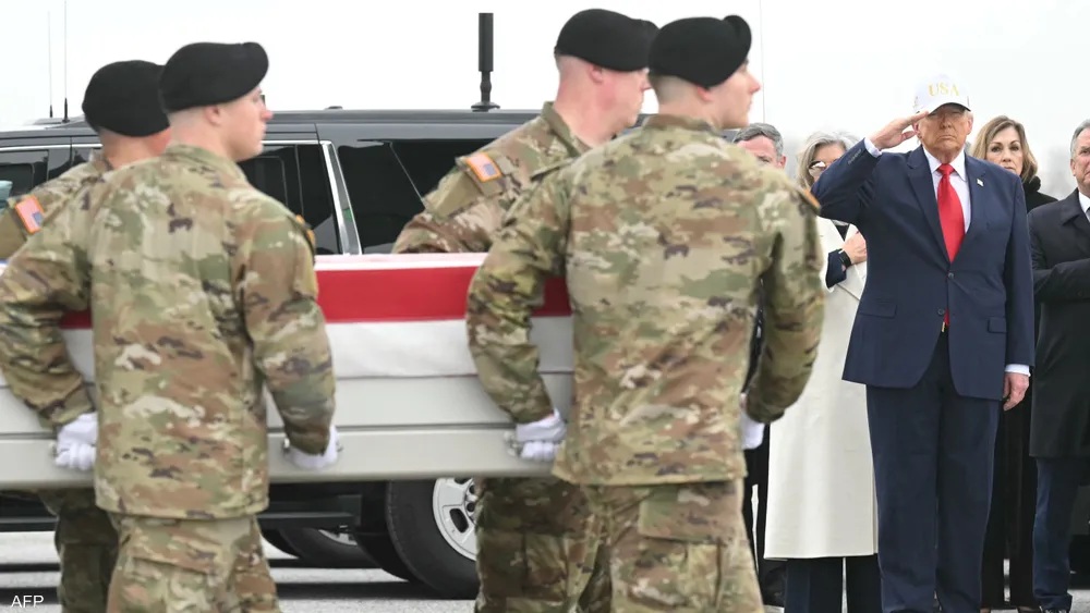 US President Donald Trump salutes during a ceremony honoring six American soldiers killed in the Middle East.