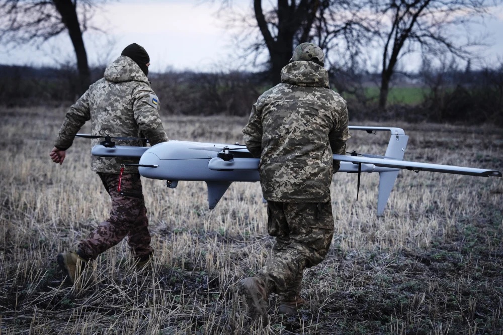 Ukrainian soldiers prepare a drone at the frontline near Bakhmut in Ukraine's Donetsk region on March 26.Efrem Lukatsky / AP file