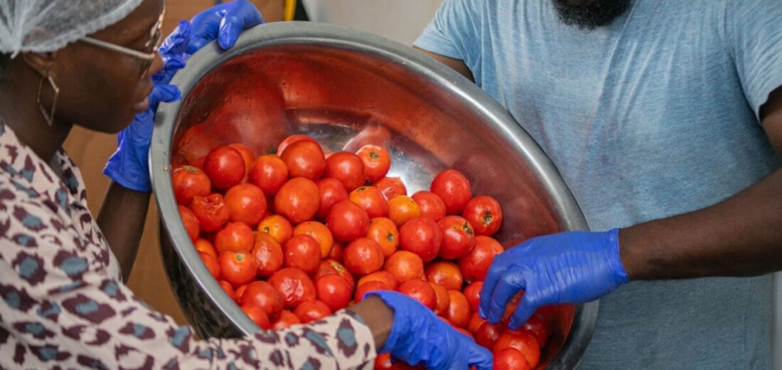 Fresh tomatoes displayed at a local market in Accra, Ghana, as traders respond to renewed cross-border supply flows from Burkina Faso.