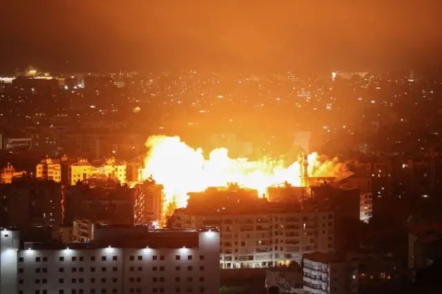 Smoke and flames rise from a strike site in southern Lebanon following reported Israeli airstrikes, as emergency crews respond amid ongoing escalation.