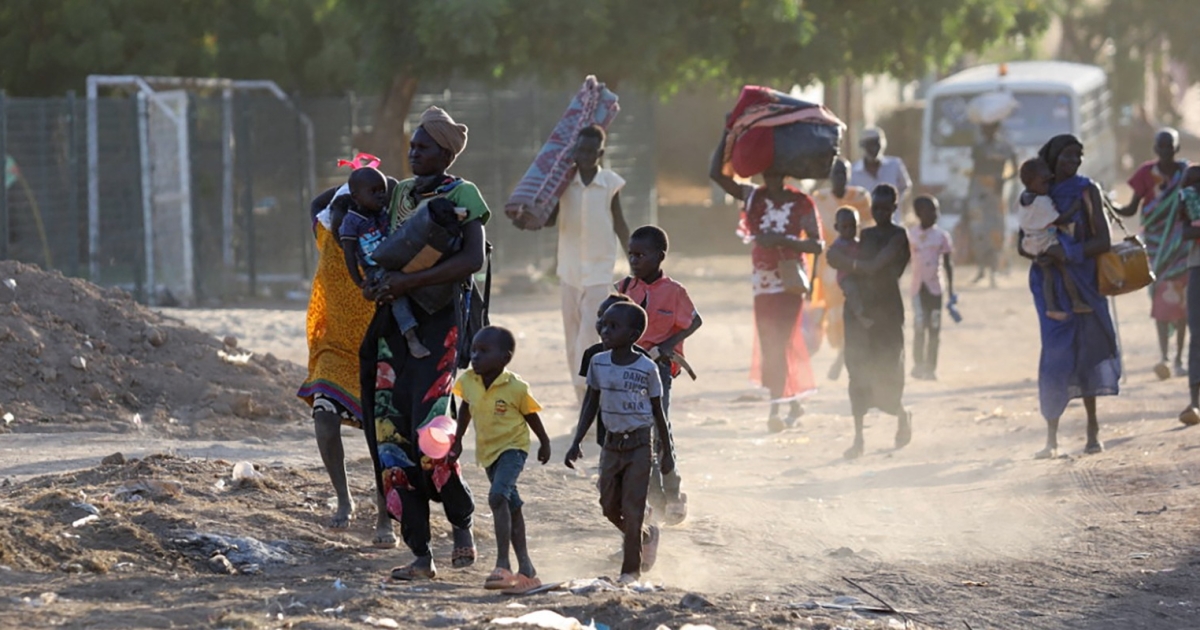 South Sudanese civilians navigate destruction amid conflict, highlighting urgent humanitarian needs. Photo courtesy: Action Against Hunger.