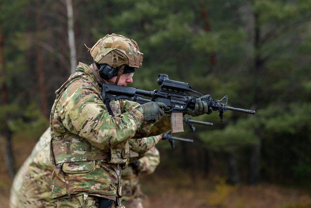 SMASH 2000 fire-control system mounted on a standard infantry rifle, using AI-assisted targeting and computer vision to help soldiers detect, track, and engage fast-moving aerial threats such as small drones with enhanced precision.