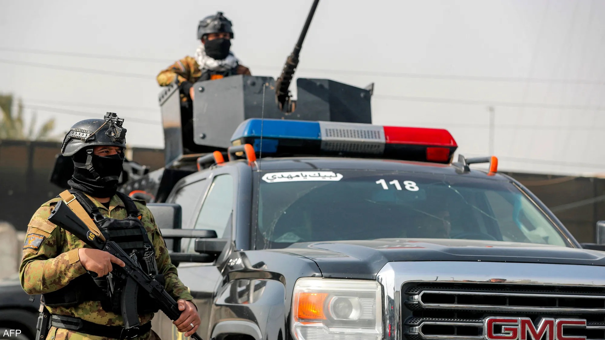 Iraqi security forces stand guard during an operational deployment.