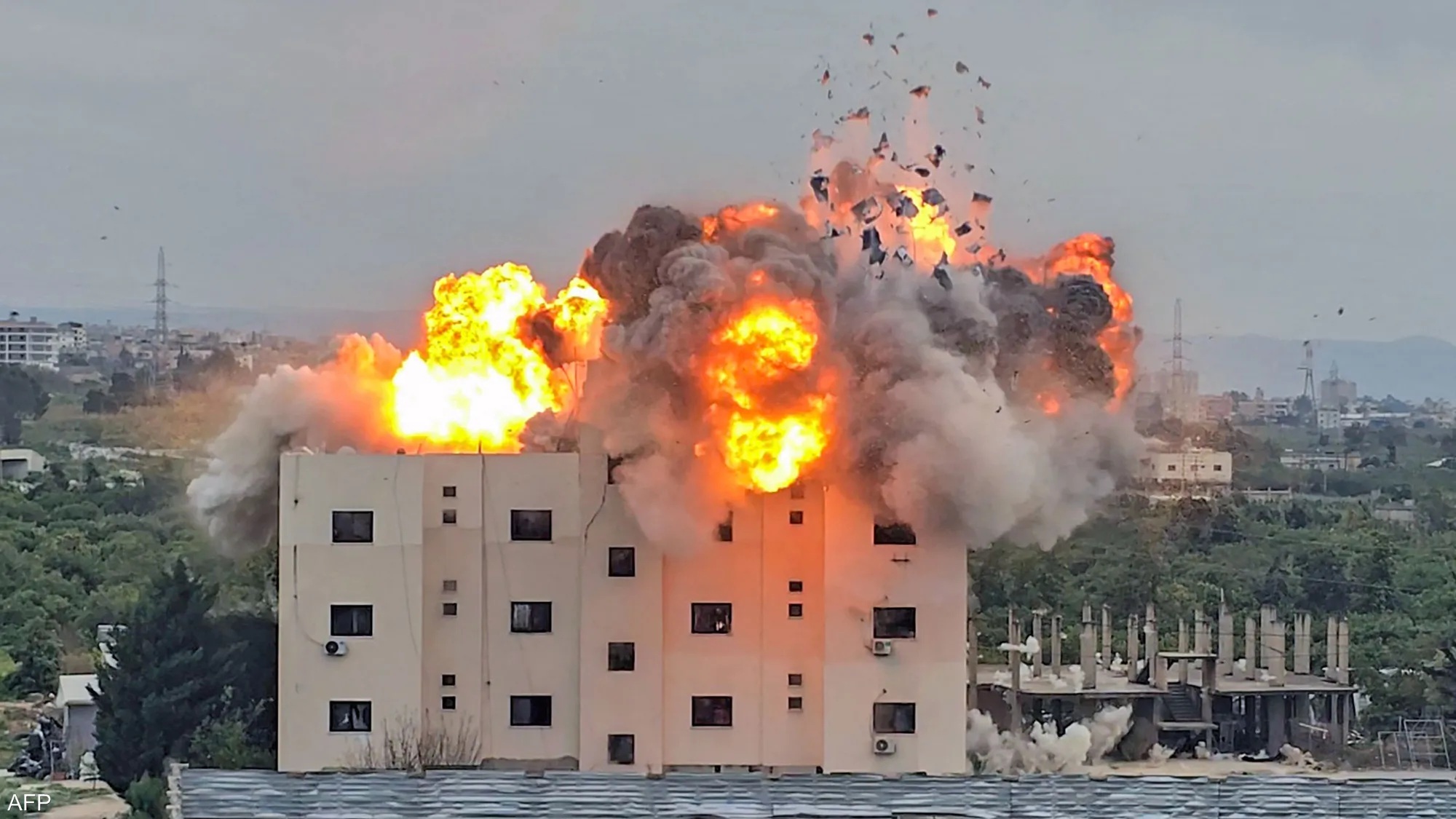 Smoke billows as an Israeli airstrike violently strikes a town in southern Lebanon.