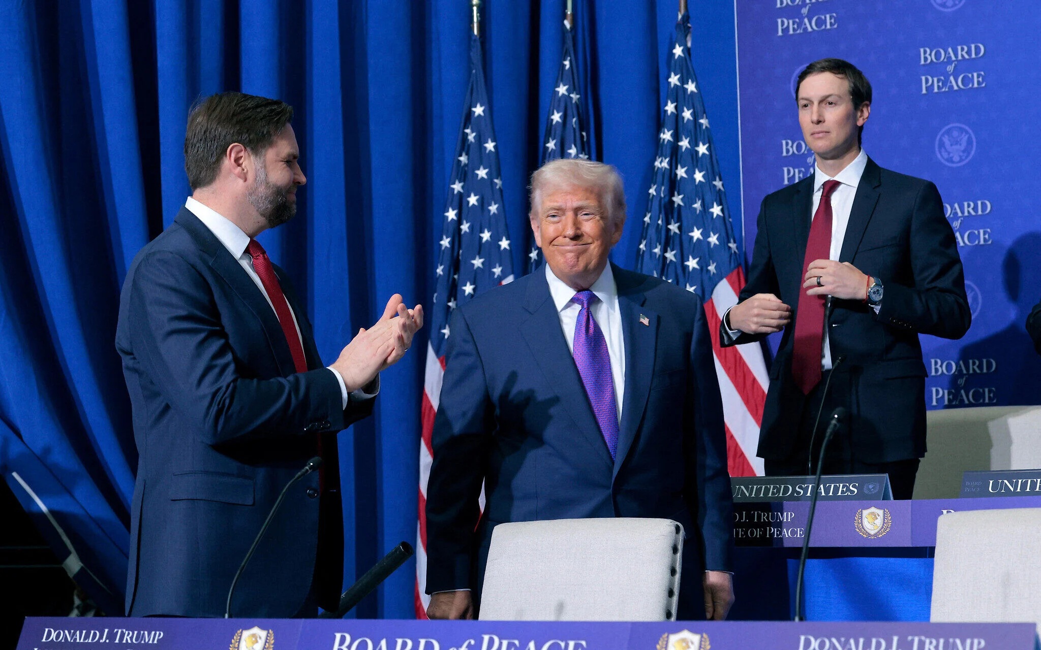 US Vice President JD Vance (L) and Jared Kushner (R) watch as US President Donald Trump arrives for the inaugural meeting of the Board of Peace at the Institute of Peace on February 19, 2026 in Washington, DC. (Chip Somodevilla/Getty Images/AFP)