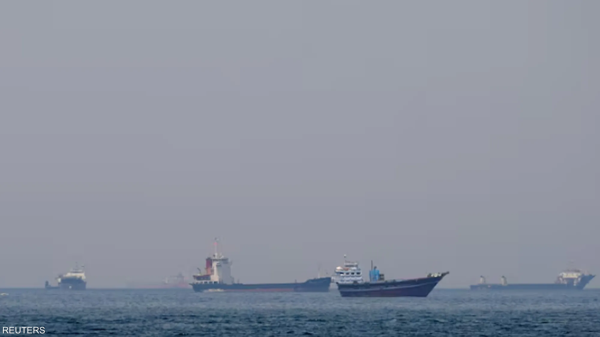 Cargo vessels transit the Strait of Hormuz as regional tensions disrupt one of the world's most critical energy shipping routes.
