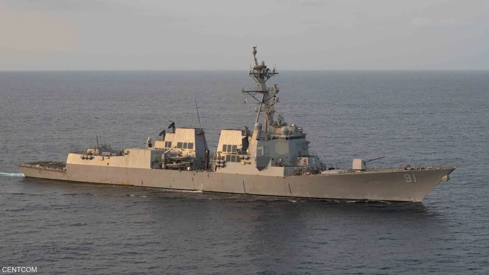 A U.S. Navy guided-missile destroyer conducts maritime patrol operations in international waters, projecting presence and monitoring strategic sea lanes amid heightened regional tensions.