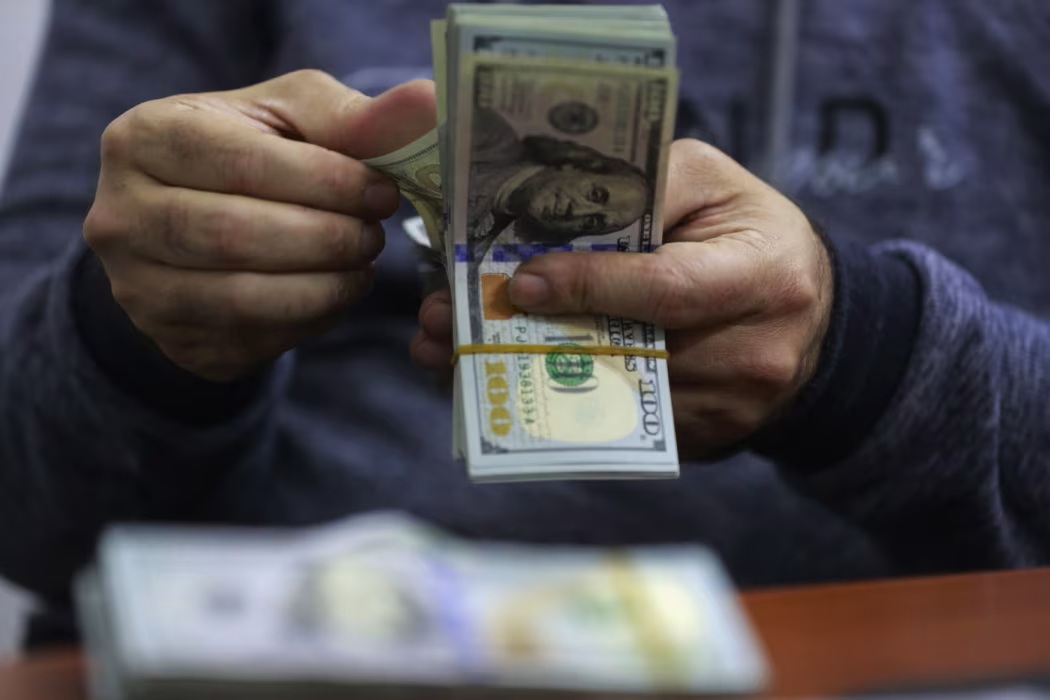 Close-up image of US dollar banknotes symbolizing global currency flows and financial policy measures.