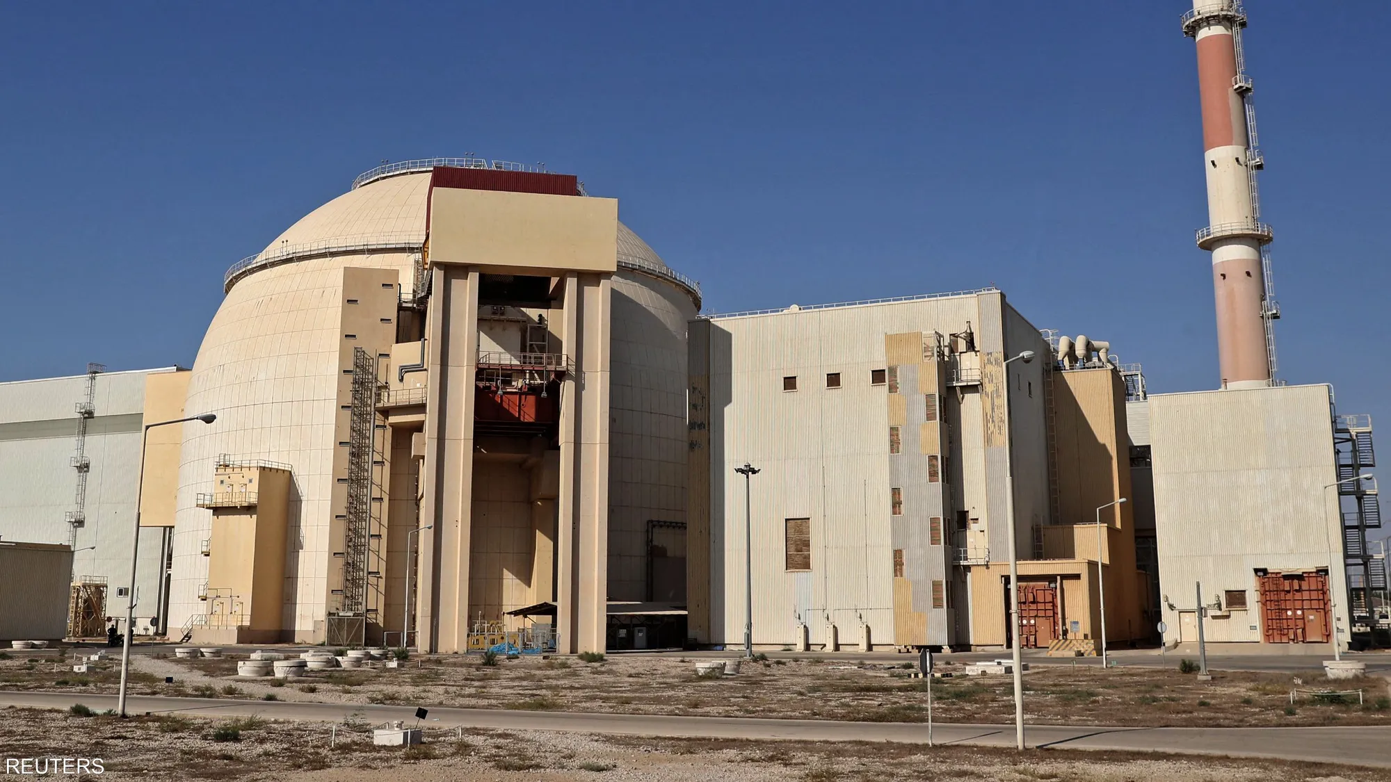 Russian technicians operate at Iran's Bushehr nuclear power plant as Rosatom reduces its on-site workforce following a phased evacuation amid regional tensions.