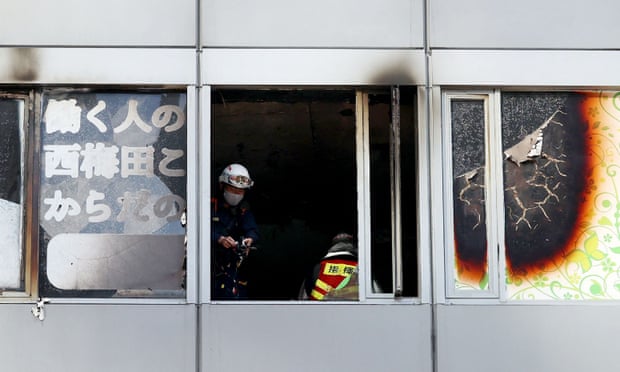 The charred interior of the fourth floor of the narrow office building was visible through broken and blackened windows STR JIJI PRESS/AFP