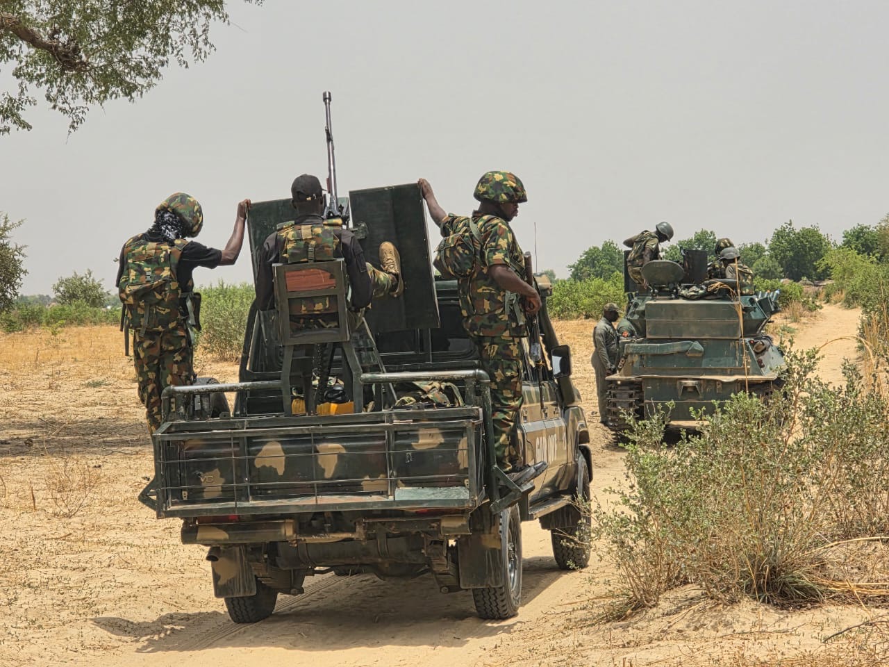 Nigerian troops patrol a rural area during a security operation in northern Nigeria amid ongoing efforts to combat armed group activity and protect vulnerable communities.