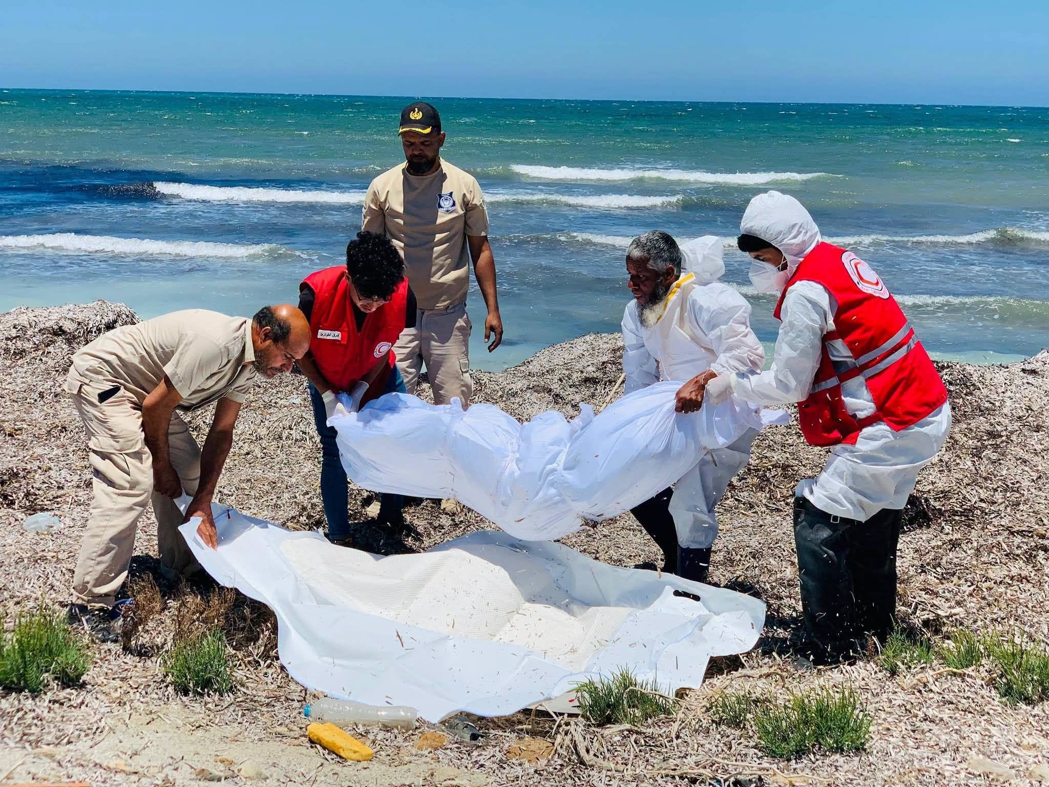 Recovery of a body along Libya's eastern Tobruk coastline following a migrant boat wreck, where rescue teams continue search and recovery operations.