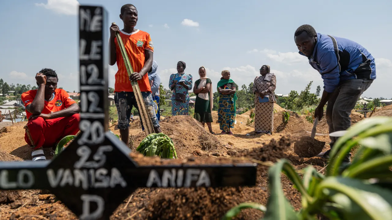 Relatives of Vanisa Anifa, a 6-month-old orphaned girl who died of Ebola, attend her burial, in Bunia, Congo, Friday, June 19, 2026. (AP Photo/Moses Sawasawa)