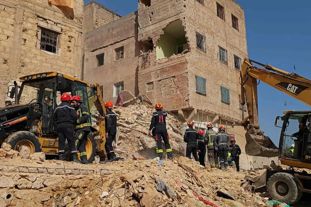 Rescue teams search through the rubble of a collapsed four-storey residential building in Fez, Morocco, where at least nine people were killed and several others injured in an overnight disaster.