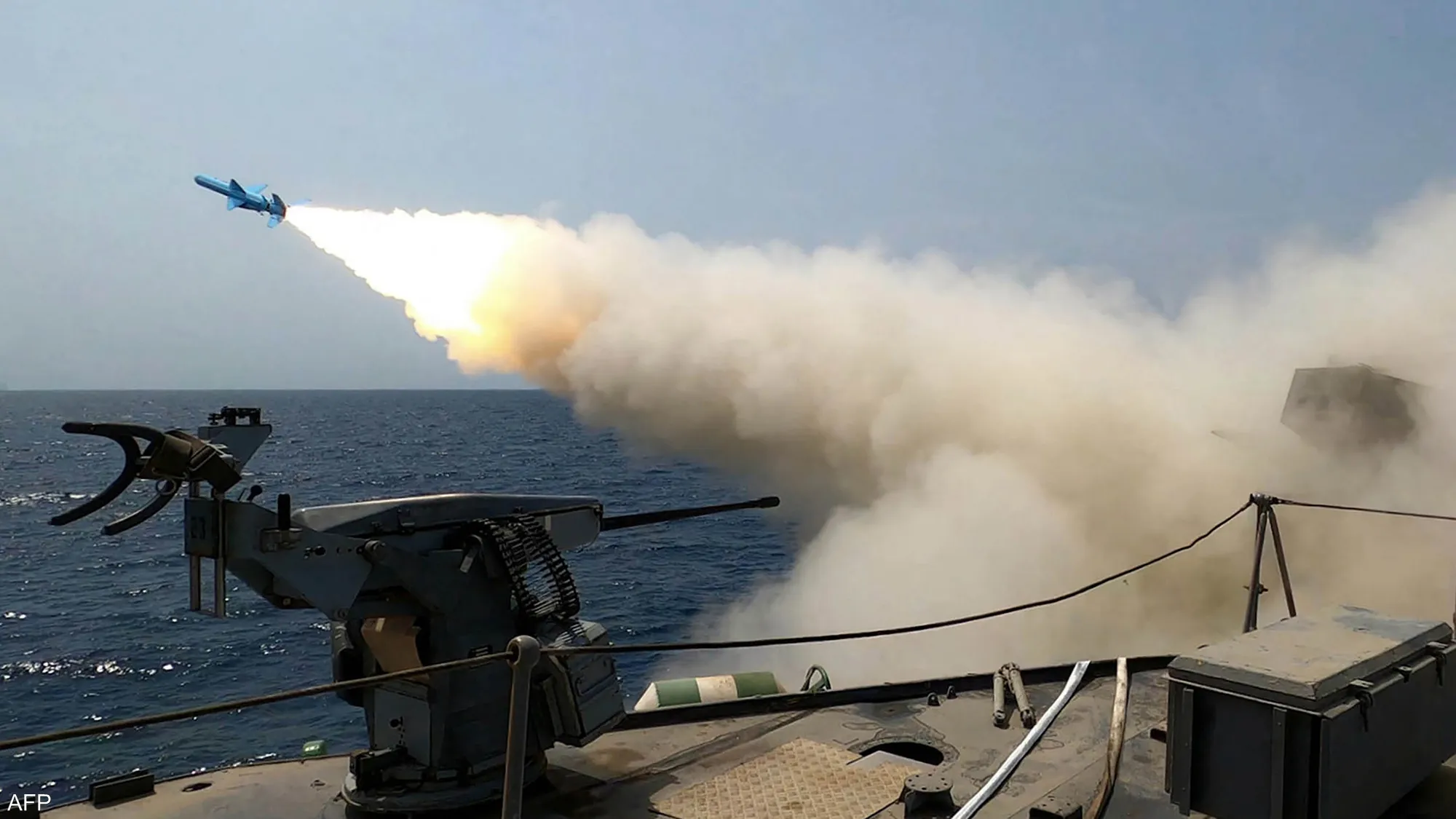 An Iranian Revolutionary Guard Corps naval vessel launches missiles and explosive-laden drones during a reported military operation. (Archived photo)