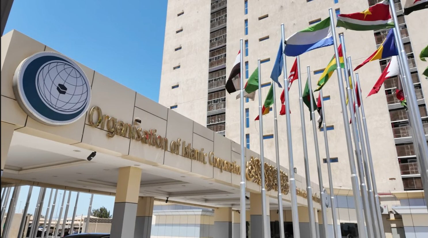 Flags of member states displayed outside the headquarters of the Organisation of Islamic Cooperation (OIC) in Jeddah, Saudi Arabia.