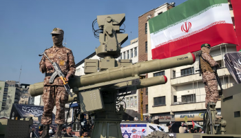 Islamic Revolutionary Guard Corps soldiers stand guard next to an anti-aircraft missile in Tehran. Morteza Nikoubazl / NurPhoto via Getty Images file.