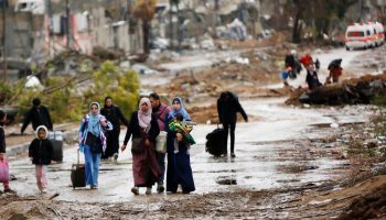 Displaced people walk from the north of Gaza towards the south, as ambulances head in the other direction. Photo (UNRWA/Ashraf Amra)