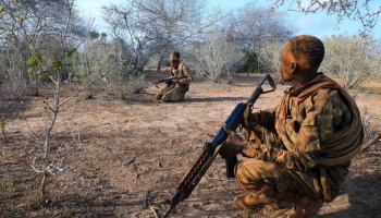 Somalia's elite Danab Commandos patrol a rural area during a security operation, maintaining vigilance as part of ongoing efforts to protect civilians and counter militant activity.