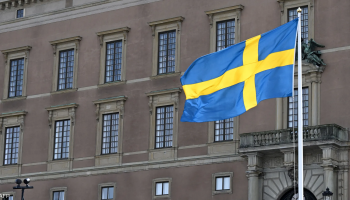 The national flag of Sweden displayed prominently in a calm breeze.