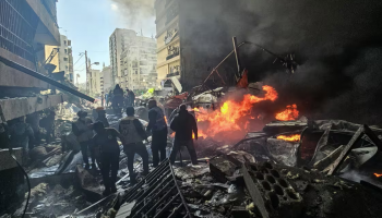 First responders stand amid rubble at the site of an Israeli airstrike in Beirut's Corniche al-Mazraa neighborhood on Wednesday.AFP - Getty Images