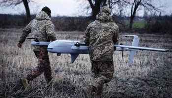 Ukrainian soldiers prepare a drone at the frontline near Bakhmut in Ukraine's Donetsk region on March 26.Efrem Lukatsky / AP file