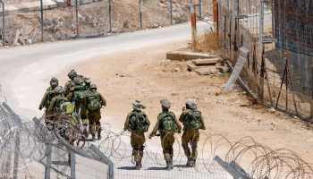 Israeli forces seen walking through southern Syria's Quneitra countryside during reported incursions and heightened military activity in the border area.