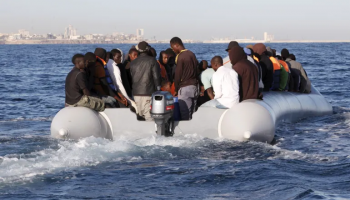 Migrants on an inflatable boat in the Mediterranean Sea attempting to reach Europe.