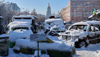Snow covered, damaged Russian military vehicles are on display in downtown Kyiv, Ukraine, Friday, Jan. 16, 2026. (AP Photo/Efrem Lukatsky)