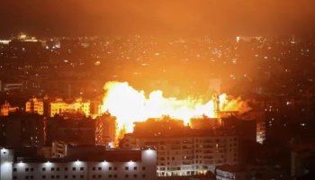 Smoke and flames rise from a strike site in southern Lebanon following reported Israeli airstrikes, as emergency crews respond amid ongoing escalation.