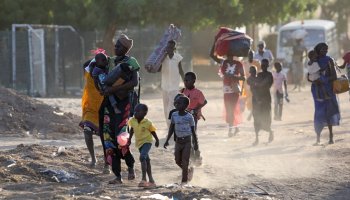 South Sudanese civilians navigate destruction amid conflict, highlighting urgent humanitarian needs. Photo courtesy: Action Against Hunger.