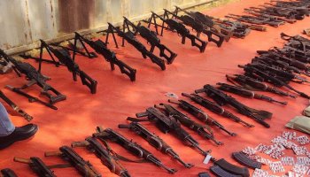 Weapons, ammunition and narcotic pills seized by Sudanese security forces are displayed in White Nile State on August 23, 2026.