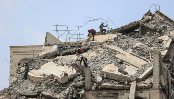 Heavily damaged residential buildings lie in ruins after Israeli airstrikes in the Gaza Strip.
