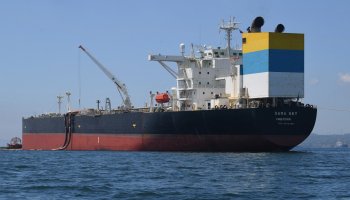 The Sierra Leone-flagged Sara Sky, which is carrying crude oil from Russia, is seen anchored at Limay port, Bataan province on March 26, 2026. A ship carrying more than 700,000 barrels of Russian crude oil has arrived in the Philippines, a source with knowledge of the matter told AFP on March 26, days after the country declared a national energy emergency over the Middle East war. TED ALJIBE / AFP