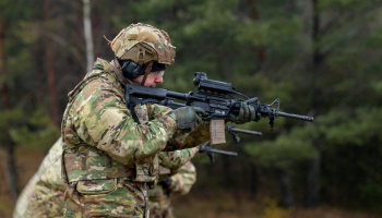SMASH 2000 fire-control system mounted on a standard infantry rifle, using AI-assisted targeting and computer vision to help soldiers detect, track, and engage fast-moving aerial threats such as small drones with enhanced precision.