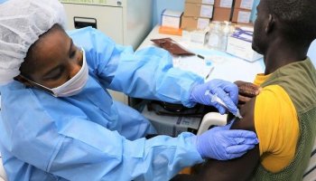 Ebola response teams in full protective gear manage screening and isolation operations at a treatment facility in eastern Democratic Republic of the Congo during an active outbreak.