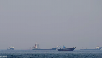 Cargo vessels transit the Strait of Hormuz as regional tensions disrupt one of the world's most critical energy shipping routes.