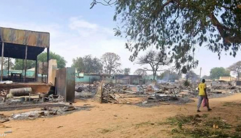 Rubble of a destroyed building in Sudan highlights extensive damage to civilian areas caused by the conflict and resulting displacement.