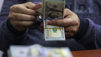 Close-up image of US dollar banknotes symbolizing global currency flows and financial policy measures.