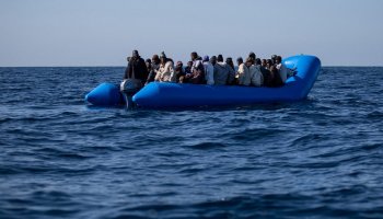 Inflatable boat carrying migrants intercepted off Libya's Tobruk coast during a maritime patrol operation.