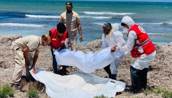 Recovery of a body along Libya's eastern Tobruk coastline following a migrant boat wreck, where rescue teams continue search and recovery operations.