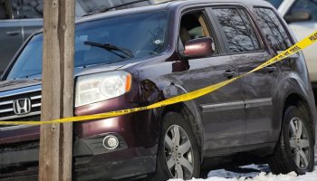 Tim Evans/Reuters - PHOTO: Police tape is seen around a vehicle with a bullet hole the windshield after a driver was shot in Minneapolis, on Jan. 7, 2026.