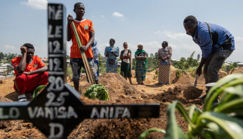 Relatives of Vanisa Anifa, a 6-month-old orphaned girl who died of Ebola, attend her burial, in Bunia, Congo, Friday, June 19, 2026. (AP Photo/Moses Sawasawa)
